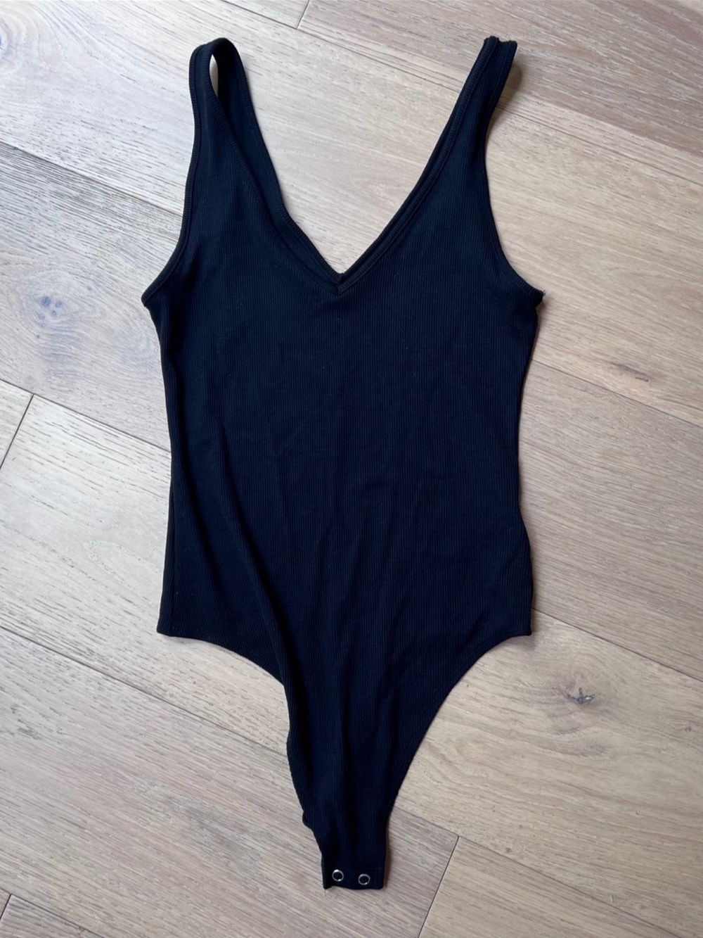 Black Ribbed V-Neck One-Piece Bodysuit